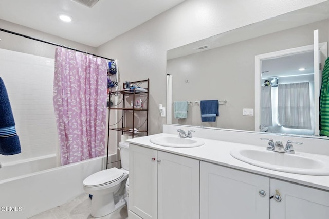 full bathroom with vanity, toilet, tile patterned floors, and shower / bath combo with shower curtain