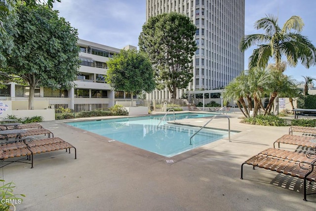 view of swimming pool with a patio area