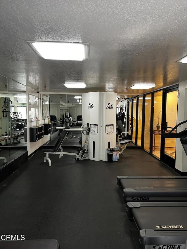 workout area with a textured ceiling