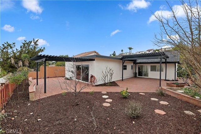 back of house with a patio and a pergola