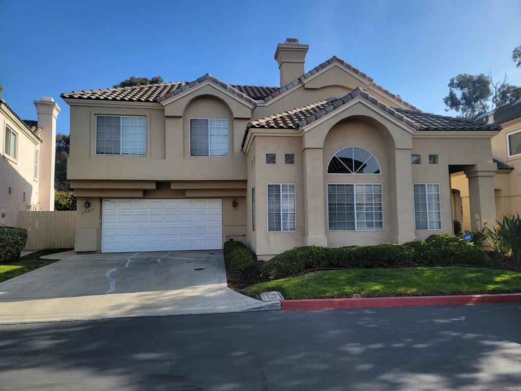 mediterranean / spanish house featuring a garage