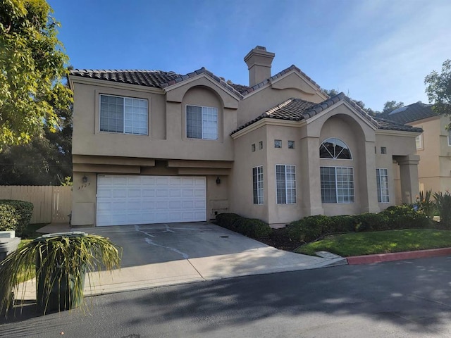 mediterranean / spanish-style house featuring a garage