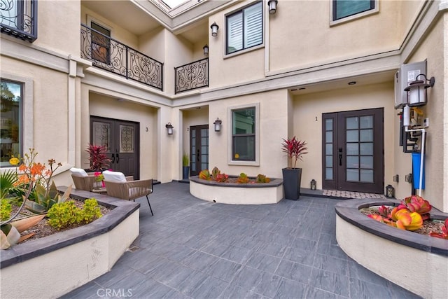 doorway to property with a patio and french doors