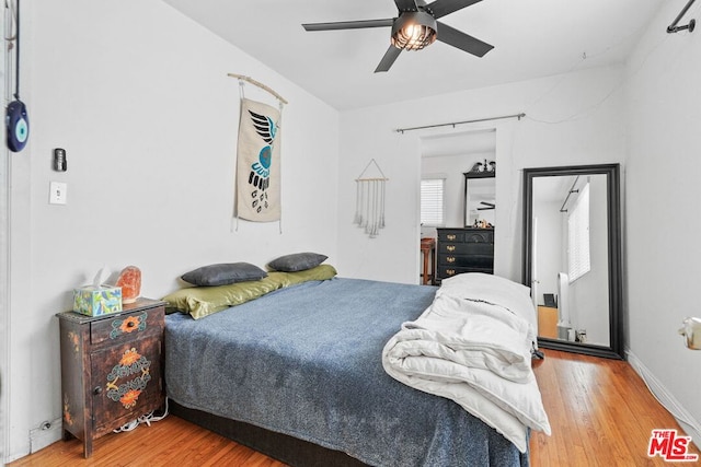 bedroom featuring hardwood / wood-style floors and ceiling fan