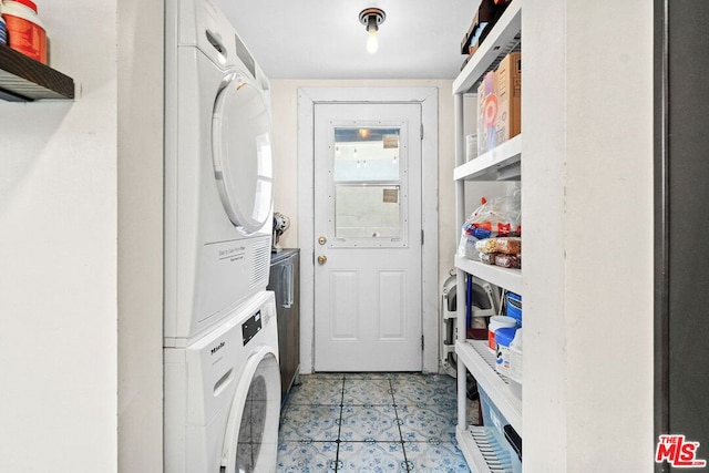 laundry room featuring stacked washing maching and dryer