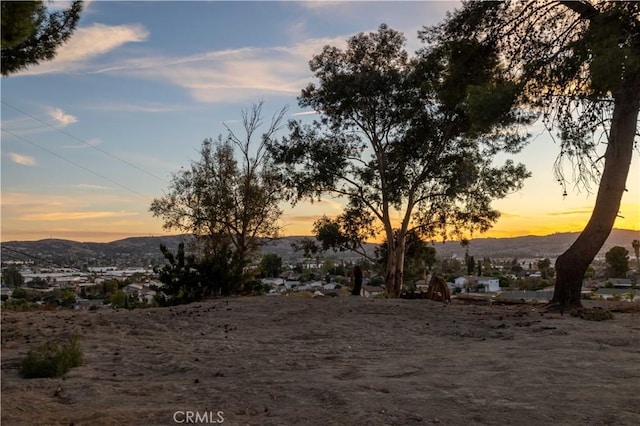 yard at dusk with a mountain view