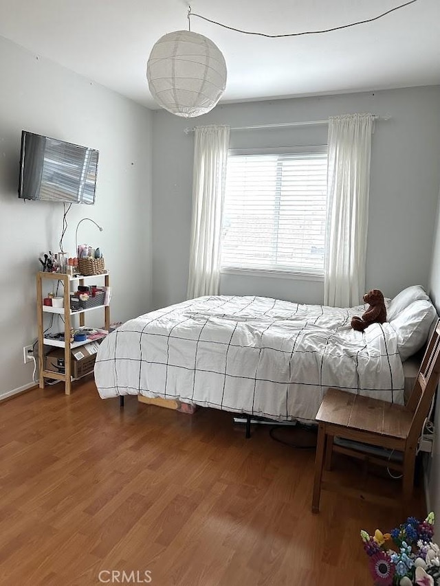 bedroom featuring wood-type flooring