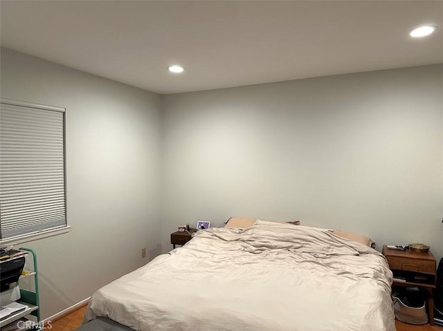 bedroom featuring wood-type flooring