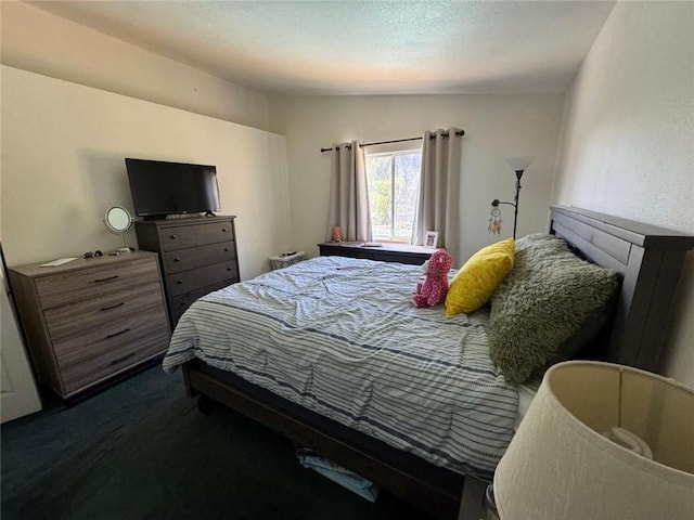 carpeted bedroom featuring lofted ceiling