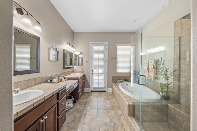 bathroom featuring vanity and plus walk in shower