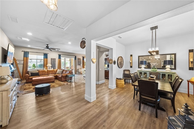 dining space featuring ceiling fan and light wood-type flooring