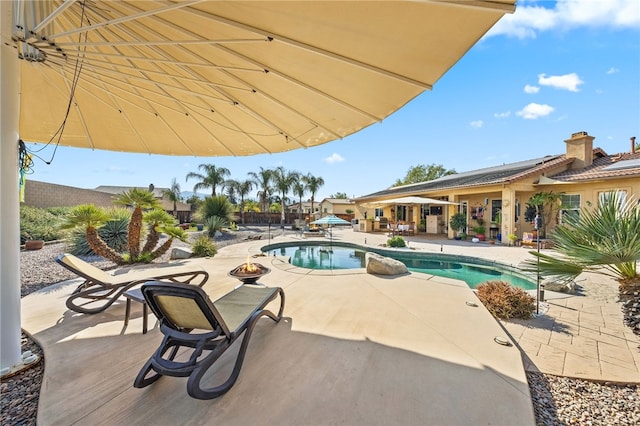 view of swimming pool with a patio