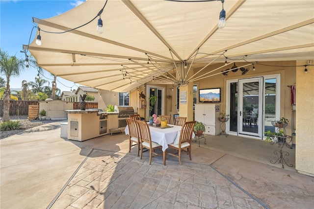 view of patio / terrace featuring a grill and exterior kitchen