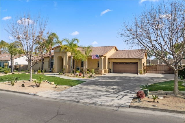 mediterranean / spanish house featuring a garage