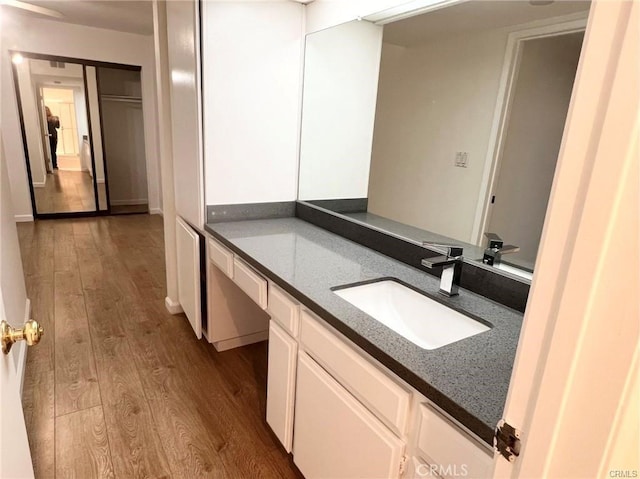 bathroom with vanity and hardwood / wood-style floors