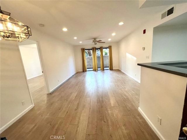 empty room featuring hardwood / wood-style flooring and ceiling fan