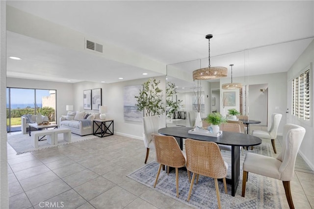 dining room with light tile patterned floors, recessed lighting, visible vents, and baseboards