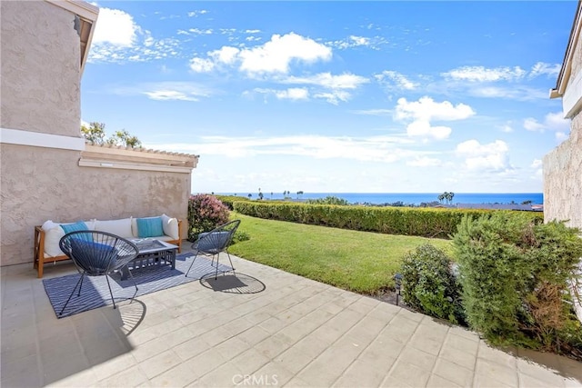 view of patio / terrace with an outdoor hangout area and a deck with water view