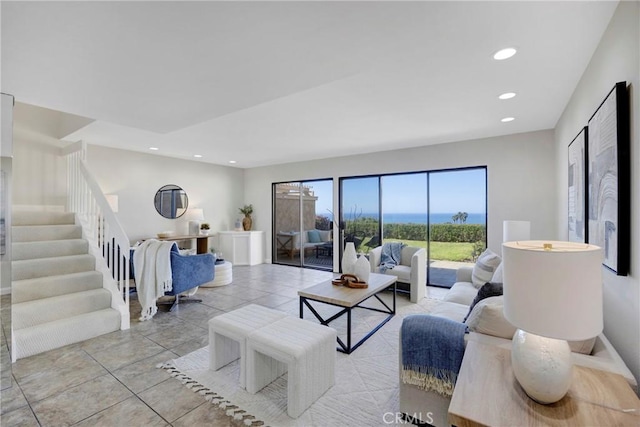 living room with stairs, baseboards, and recessed lighting