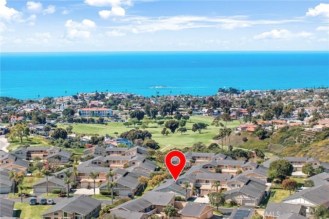 drone / aerial view with a water view and a residential view