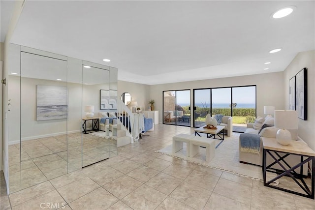 living area with stairs, light tile patterned flooring, baseboards, and recessed lighting