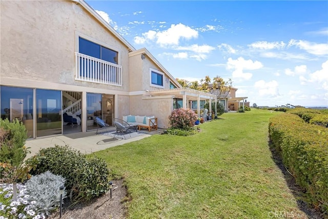 view of yard with outdoor lounge area, a patio, and a pergola