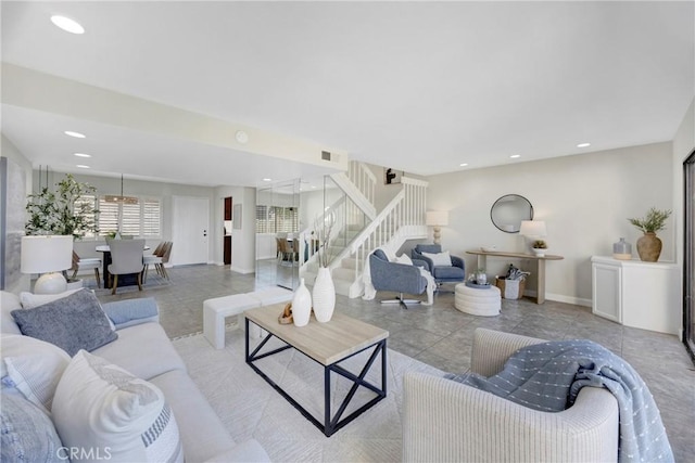 tiled living room featuring visible vents, stairway, baseboards, and recessed lighting