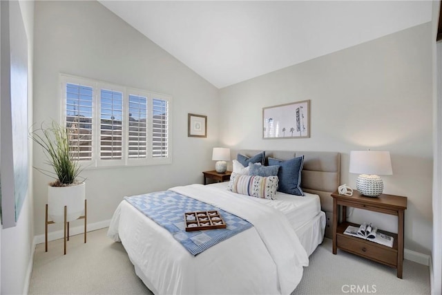 bedroom featuring lofted ceiling, carpet flooring, and baseboards