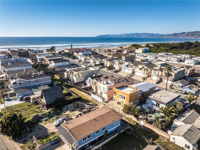 drone / aerial view with a water and mountain view