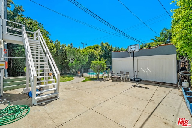 view of patio / terrace with a swimming pool