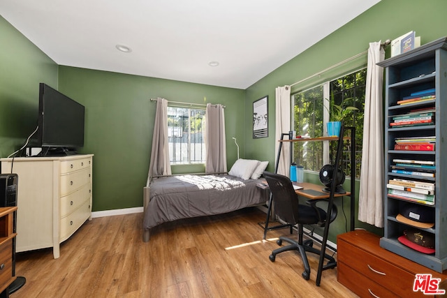 bedroom with light wood-type flooring