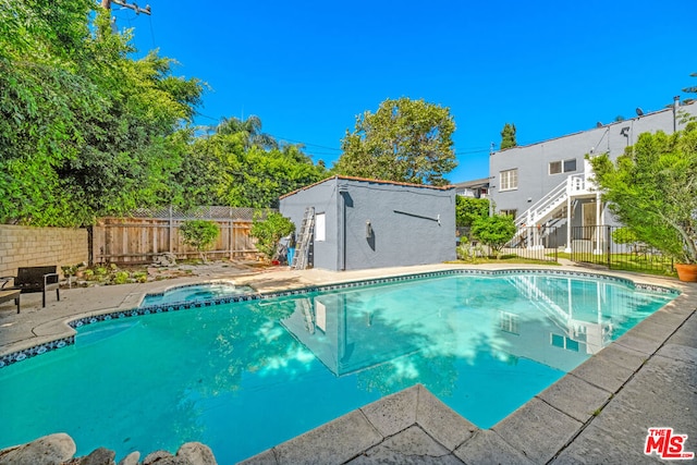 view of swimming pool with a patio area