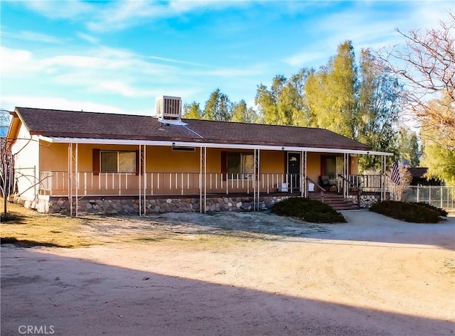 view of front of house with cooling unit and covered porch