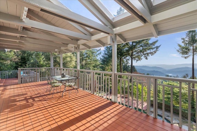 wooden terrace with a mountain view