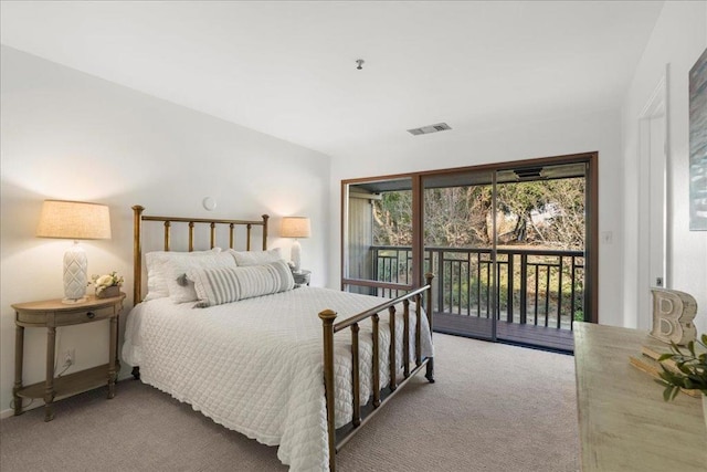 bedroom with light colored carpet and access to outside