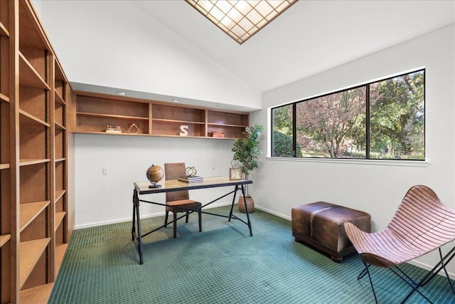 carpeted home office with high vaulted ceiling