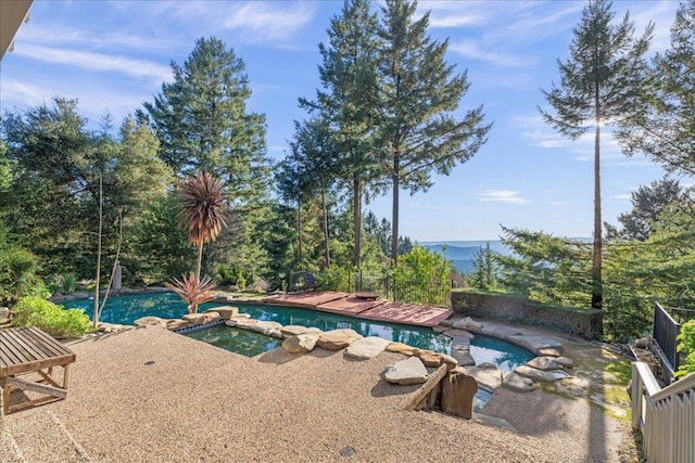 view of pool featuring an in ground hot tub