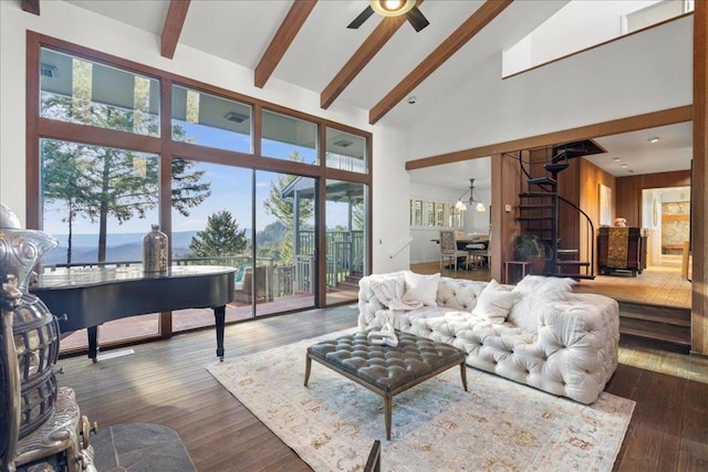 living room with a water view, beam ceiling, dark hardwood / wood-style flooring, and high vaulted ceiling