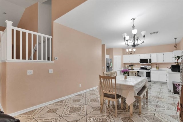 dining room featuring a notable chandelier