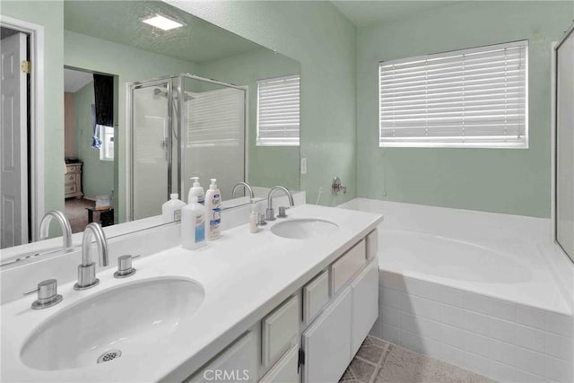 bathroom with plus walk in shower and vanity