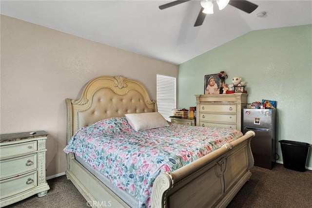 carpeted bedroom featuring stainless steel refrigerator, ceiling fan, and vaulted ceiling