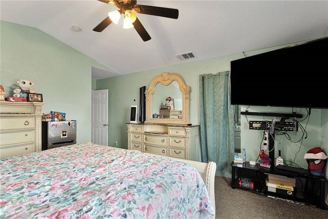 bedroom with ceiling fan, carpet flooring, and vaulted ceiling