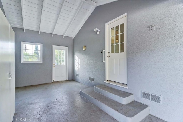 interior space with wood ceiling and lofted ceiling with beams