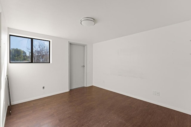 empty room featuring dark hardwood / wood-style floors