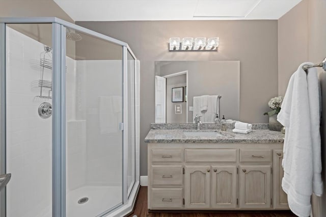 bathroom with an enclosed shower and vanity