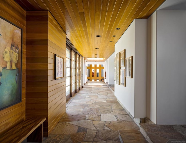 corridor with wood ceiling and wood walls