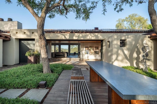 rear view of property featuring a patio area