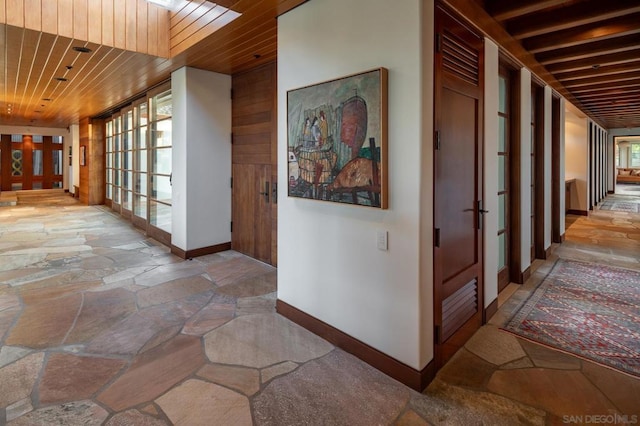 corridor with wooden ceiling and french doors