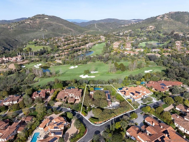 drone / aerial view featuring a water and mountain view