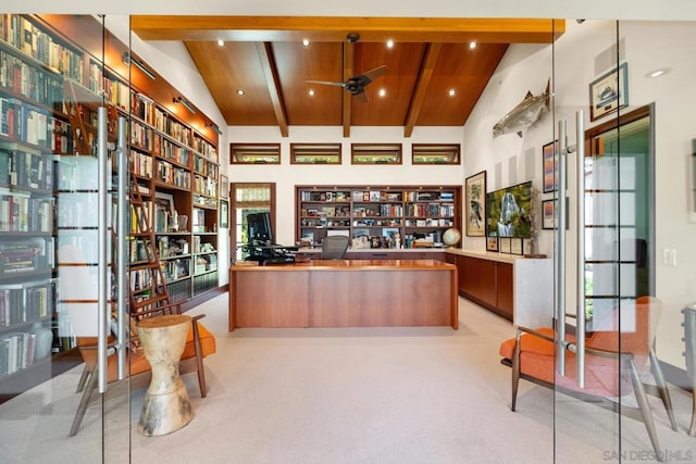 welcome area with built in desk and ceiling fan